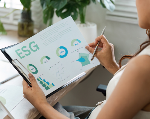 Sunny cafe with tables and chairs and a red and white striped awning